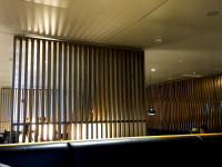 wooden elements divide the seat areas at the business lounge of swiss air at the airport in zurich