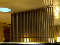 wooden elements, leather benches and cozy light in the seat areas of the business lounge of swiss air at the airport of zurich