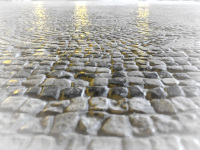 yellow lights are shining on the grey stony mosaik floor of the grandmaster palace in rhodes city