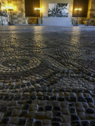 a hall of the grandmaster palace in rhodes city with cozy lights and stony mosaik floor