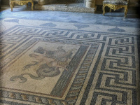 an artful mosaik floor and two baroque chairs in a hall of the grandmaster palace on rhodes