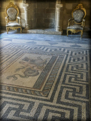 an artful mosaik floor and two baroque chairs in a hall of the grandmaster palace on rhodes