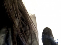 self-portrait in the mirror with leather jacket from behind