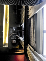 mirror self-portrait in a ship lounge