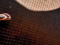 self-portrait of a foot with orange colored flip-flop