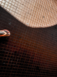 self-portrait of a foot with orange colored flip-flop