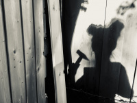 shadow self-portrait while making carpentry work