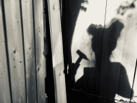 shadow self-portrait while making carpentry work