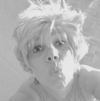 self-portrait with a kiss and a wig with blond short hairs, black-and-white