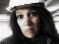 self-portrait with helmet on a construction site