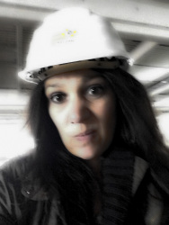 self-portrait with helmet on a construction site