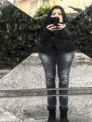 funny mirror self-portrait with handy