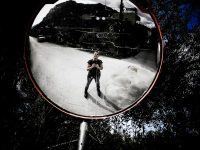 self-portrait in a traffic mirror