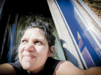 self-portrait at a wooden window and blended by the sun