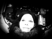 dreamy self-portrait in the engine compartment of my car, black-and-white