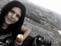 self-portrait with apple and a camera