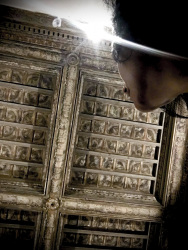 self-portrait from underneath with a historical wooden ceiling