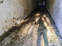 shadow self-portrait on cobblestones