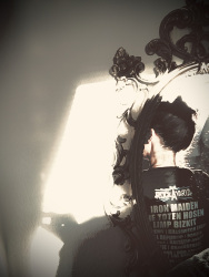 self-portrait in a mirror with some shadows, sepia