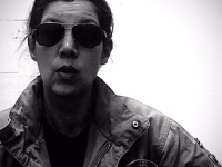 self-portrait with parka and sunglasses, black-and-white