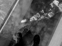 self-portrait with boots in museum, black-and-white