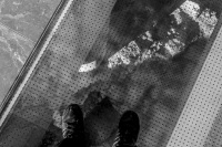 self-portrait with boots in museum, black-and-white