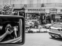self-portrait in the rear view mirror of a jeep wrangler, black-and-white