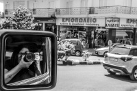 self-portrait in the rear view mirror of a jeep wrangler, black-and-white