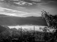 the greek village geroplatanos in epirus in morning fog, black-and-white