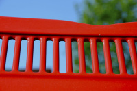 the ventilation slots of a red oldtimer in front of a blue sky