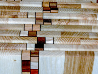 little wooden boards with a nice design are lined up in a line