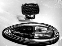the taillight of the oldtimer porsche 356, black-and-white