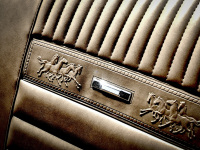 the car back seat of a ford mustang oldtimer in beige leather