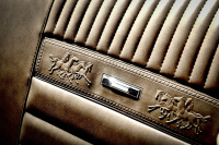 the car back seat of a ford mustang oldtimer in beige leather