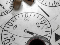 a peace of white bread, a glass of red wine and wooden toothpicks on a table painted with speetometers