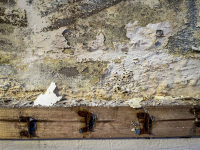 peeled paint on a wall and profile board claws on a wooden board