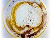a colorful coffee grounds with scandinavia in the south of the cup and crete in the north of the cup