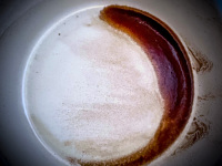 this coffee grounds was making a brown halfmoon in the cup