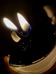 a wick is burning bilateraly