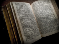 the pages of an antique bible are open at luke 21,20