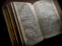 the pages of an antique bible are open at luke 21,20