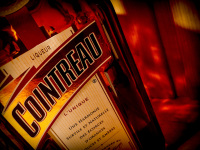 a bottle of cointreau enveloped in her own colors