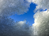 a lovely blue sky behind peaces of ice and snow