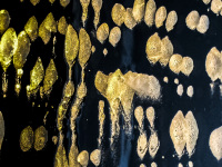the sun is shining on dabs of foam on a mirror