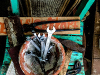 a lot of tool is laying on wooden chairs where are to renovate