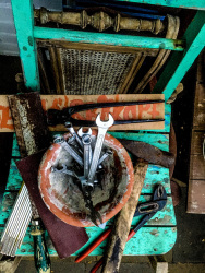 a lot of tool is laying on wooden chairs where are to renovate
