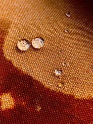 round waterdrops on a brown towel