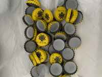 a little collection of yellow bottle caps of the cair wine retsina