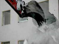 a demolition crane tears off a wall of a house in bergen in lower saxony