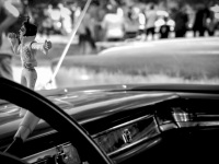 a little singing elvis puppet is hanging at the dashboard of an oldtimer at the oldtimermeeting in hermannsburg, black-and-white